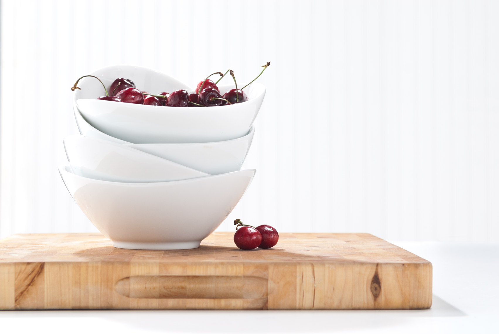 White_Bowls_On_Wood_With_Cherries